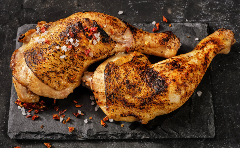 Two grilled chicken legs. View from above.