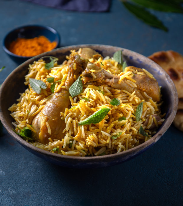 Pakistani and Indian chicken Biryani rice with mint and naa bread